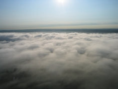 check out he fog. On the ground it's foggy, but in the air the sun is shinning and the sky is blue