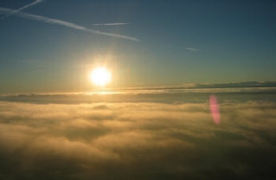 this is an incredable photo of the low level fog upon lift off at sunrise. you gotta see this to believe it